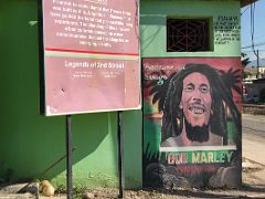 09B Mural of Bob Marley with Psalm 91 and Redemption Songs on a green building at 2nd Street and Collie Smith Dr Trench Town Kingston Jamaica